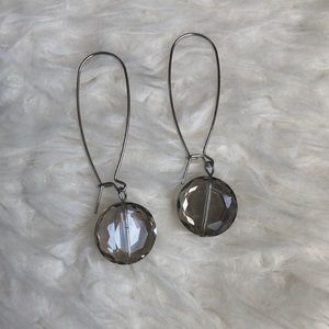 Silver dangling earrings with grey-ish crystals
